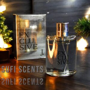 Sufi Scents EXCLUSIVE perfume bottle and silver packaging displayed on a festive wooden surface with Christmas lights.